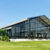 Orangery tent transparent exterior on a lawn with glass walls