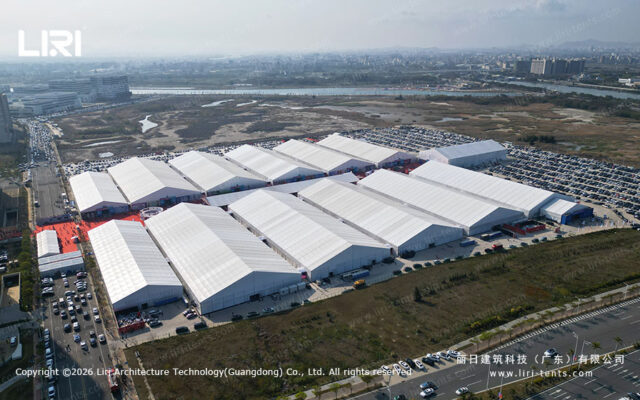Aerial view of a large aluminum structure exhibition tent complex hosting a global expo